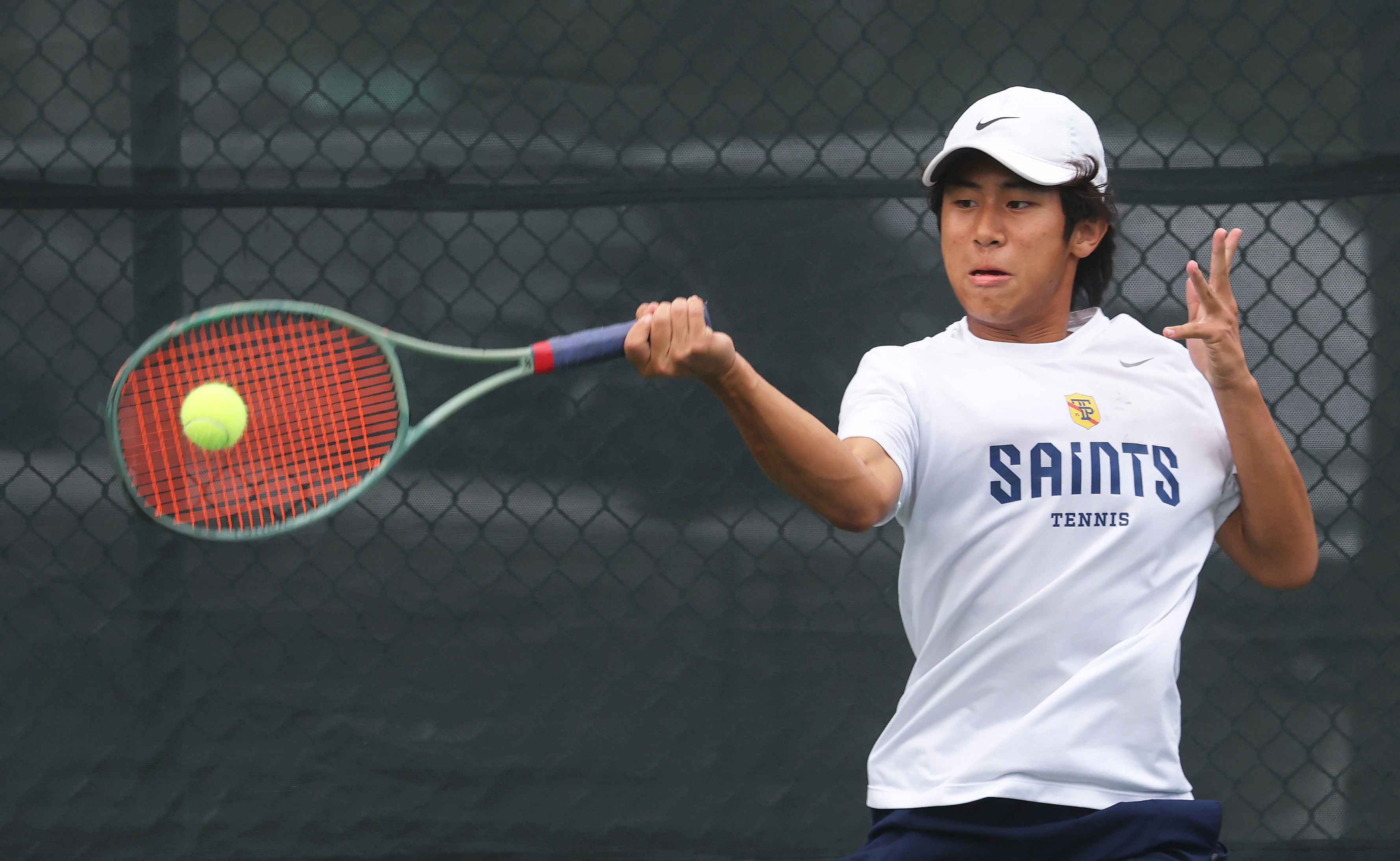 Trinity Prepâs Nathan Lu returns a volley at the 2026...