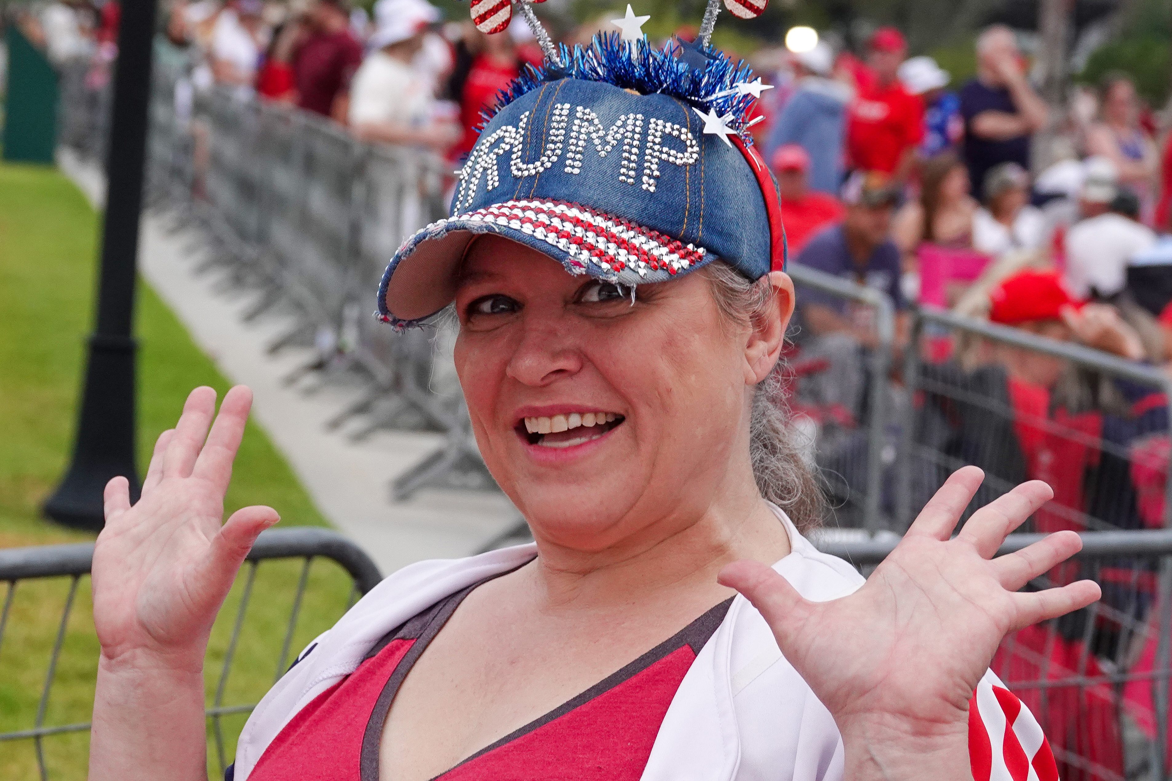 A supporter of President Donald Trump dons a special hat...