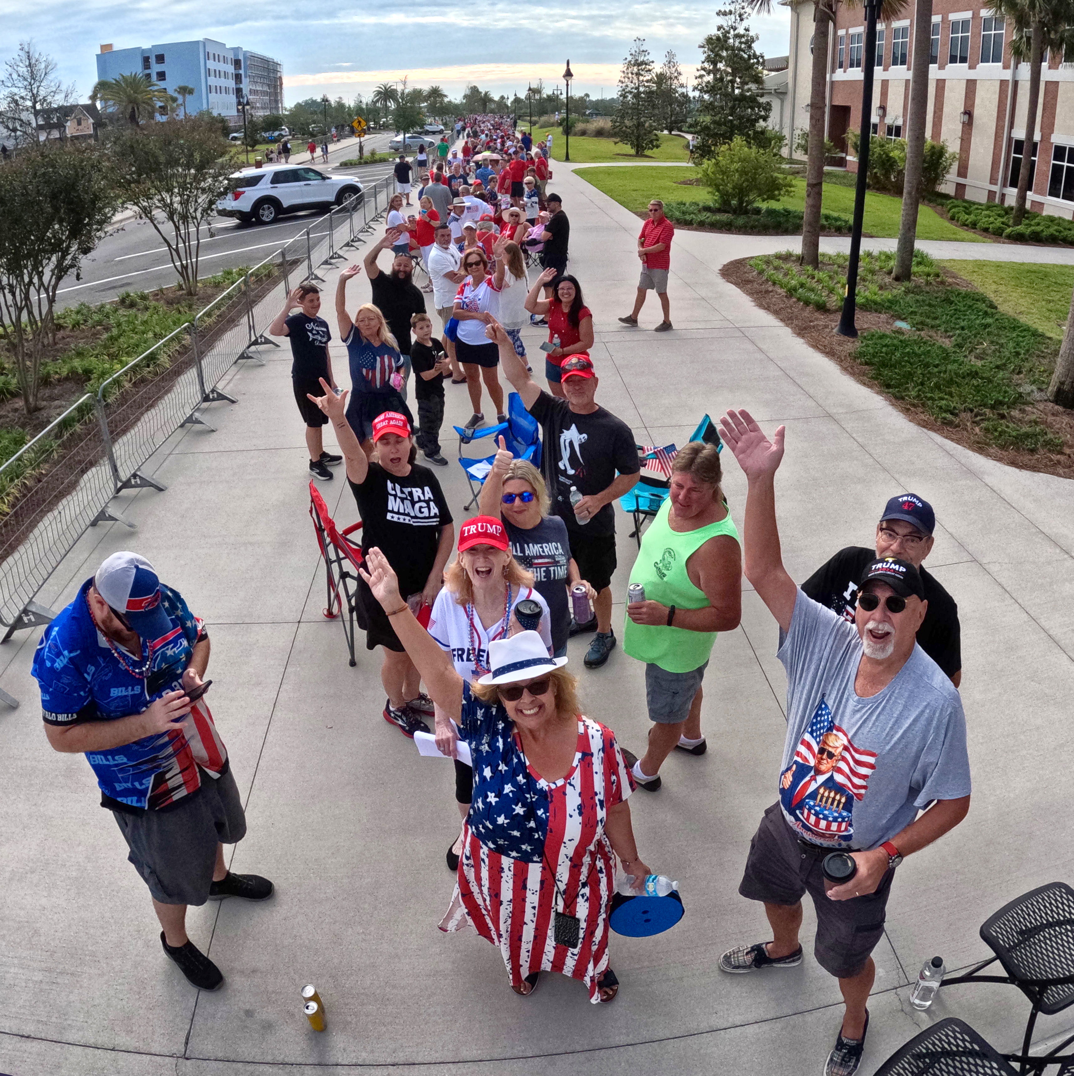 Supporters of President Donald Trump cheer while waiting for doors...