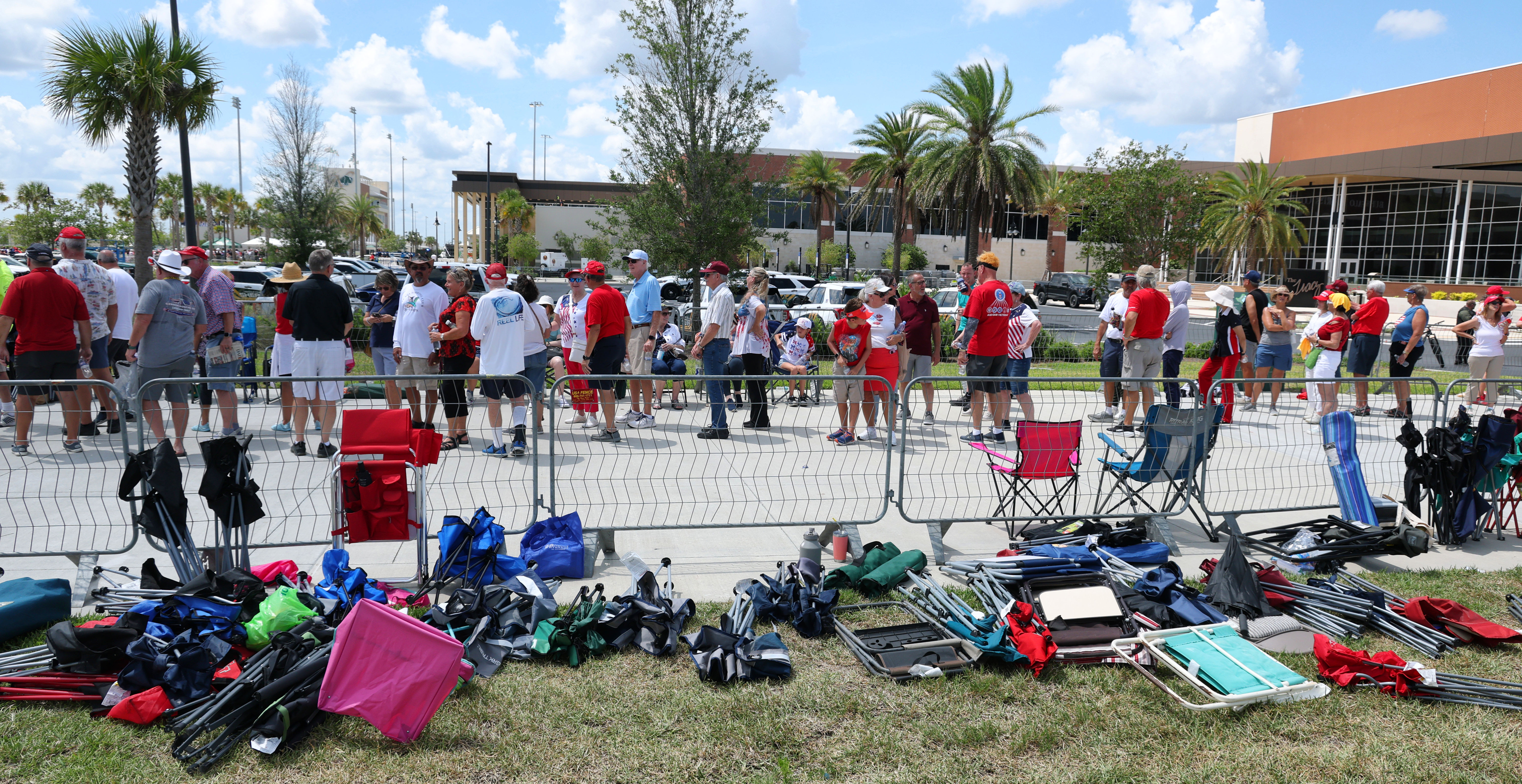 Abandoned folding chairs pile up as supporters of President Donald...