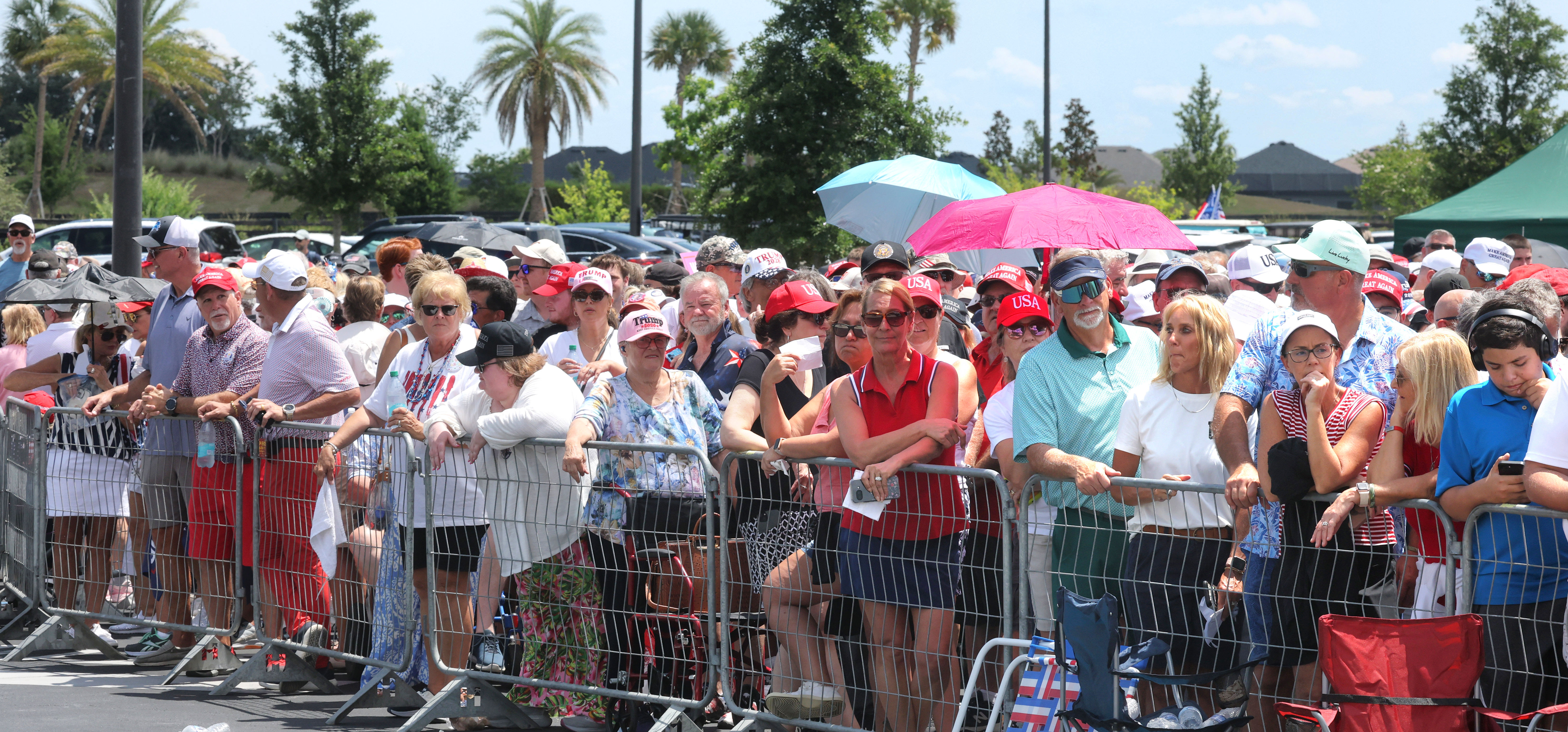 Supporters of President Donald Trump in line as temperatures soar...