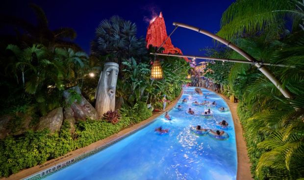 Volcano Bay water park visitors float along a lazy river during the Volcano Bay Nights event. (Universal Orlando)