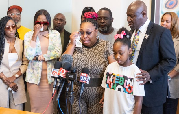 (Left to Right) Sierra Rainge, sister Kim Neal Davis, daughter Shaquail Neal, grandaughter Moyirah Griffin and attorney Ben Crump talk during a press conference about family member Gerald Neal who was killed after he was struck and killed during a high-speed chase by the Orlando Police Department in Orlando, Fla., Thursday, Feb. 27, 2025. (Willie J. Allen Jr./Orlando Sentinel)