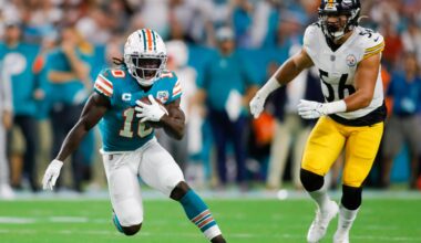 Oct 23, 2022; Miami Gardens, Florida, USA; Miami Dolphins wide receiver Tyreek Hill (10) runs with the football ahead of Pittsburgh Steelers linebacker Alex Highsmith (56) during the first quarter at Hard Rock Stadium.