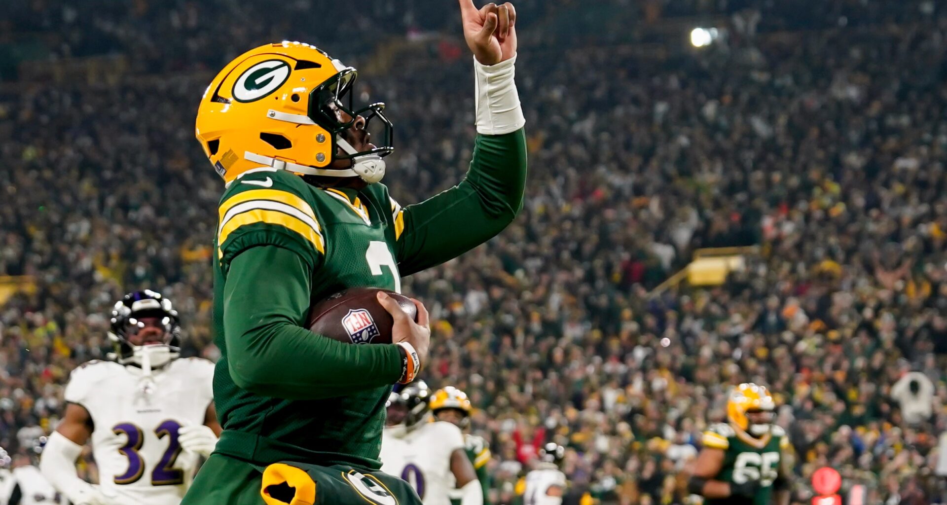 Dec 27, 2025; Green Bay, Wisconsin, USA; Green Bay Packers quarterback Malik Willis (2) celebrates after a touchdown during the second quarter against the Baltimore Ravens at Lambeau Field.