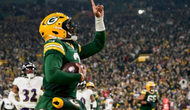 Dec 27, 2025; Green Bay, Wisconsin, USA; Green Bay Packers quarterback Malik Willis (2) celebrates after a touchdown during the second quarter against the Baltimore Ravens at Lambeau Field.