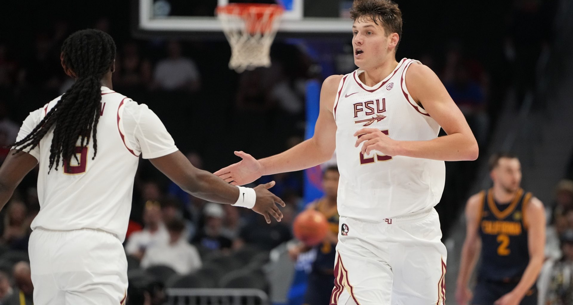 Mar 11, 2026; Charlotte, NC, USA; Florida State Seminoles forward Alex Steen (25) reacts with guard Robert McCray V. (6) in the first half at Spectrum Center.