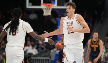 Mar 11, 2026; Charlotte, NC, USA; Florida State Seminoles forward Alex Steen (25) reacts with guard Robert McCray V. (6) in the first half at Spectrum Center.