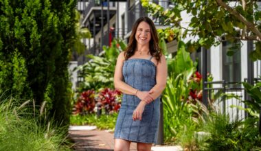 Gina Curry, CEO of NextPath Career Partners, stands in her Tampa office