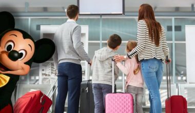 A family with suitcases checks an airport screen as Mickey Mouse welcomes them, hinting at an exciting Disney World adventure. Global Entry shutdown Disney travel. Orlando to Tokyo Disney Resort flights