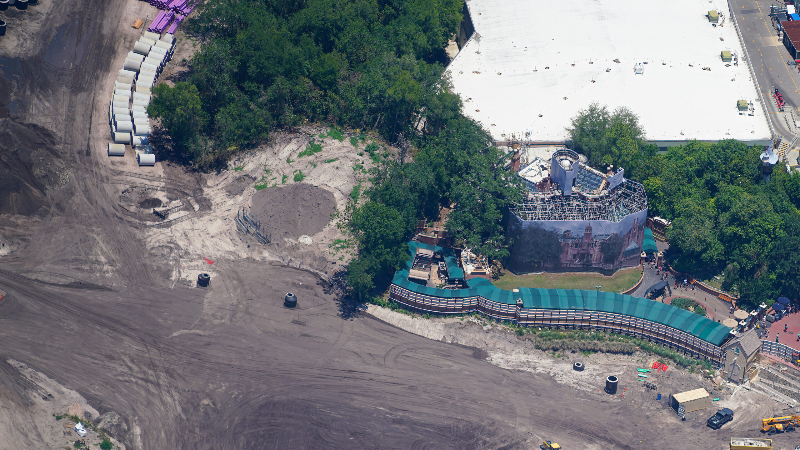 The latest aerial photos show that construction has continued to advance from early clearing and grading into more infrastructure work.