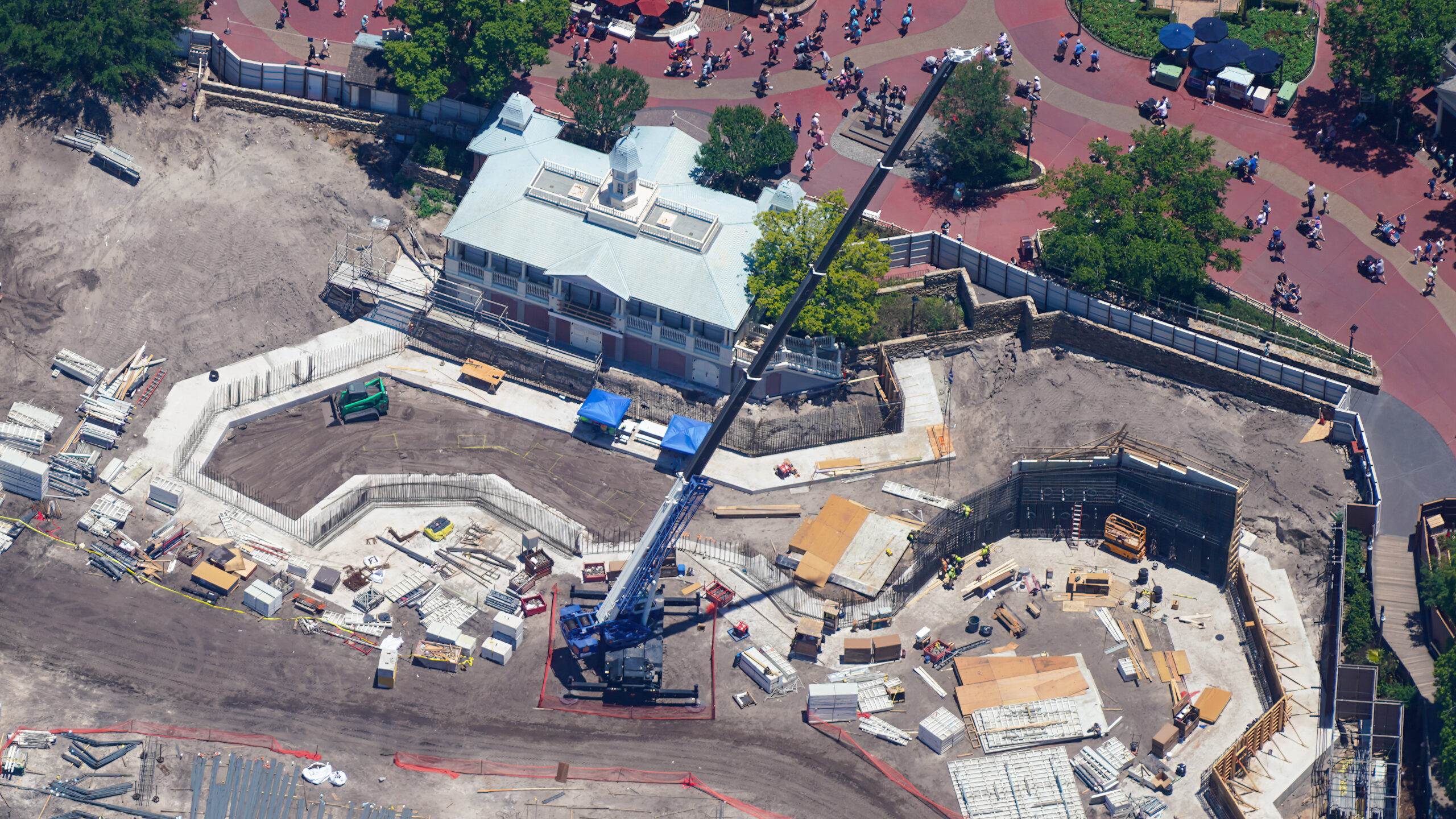 The latest aerial photos show that construction has continued to advance from early clearing and grading into more infrastructure work.
