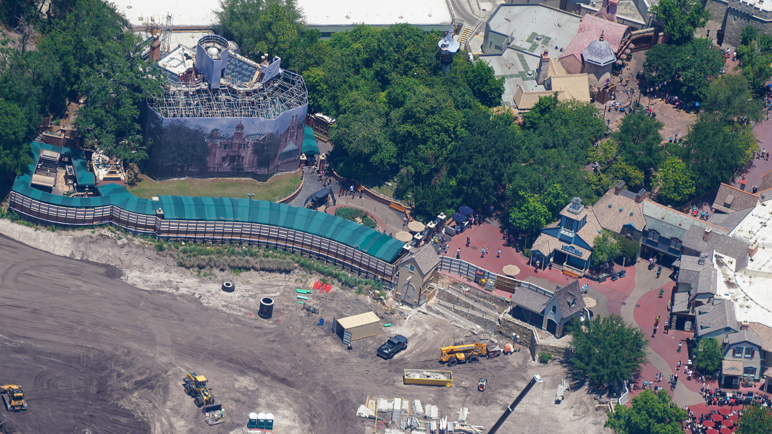 The latest aerial photos show that construction has continued to advance from early clearing and grading into more infrastructure work.