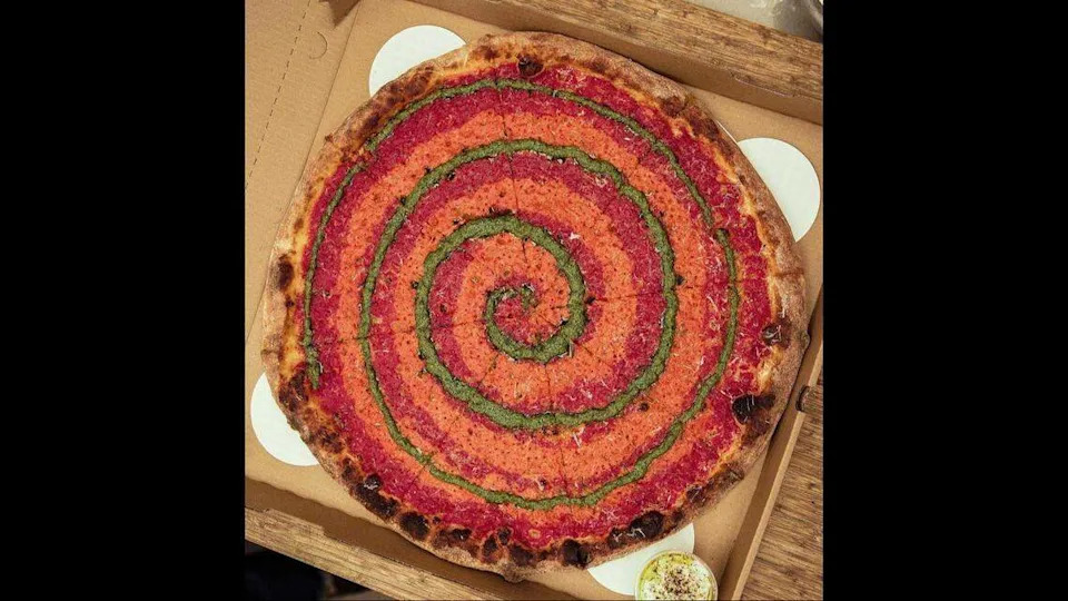 La Salsera pizza, with a pesto swirl atop marinara and vodka sauce, from Miami Slice. The downtown pizzeria is opening a new restaurant in Coconut Grove.