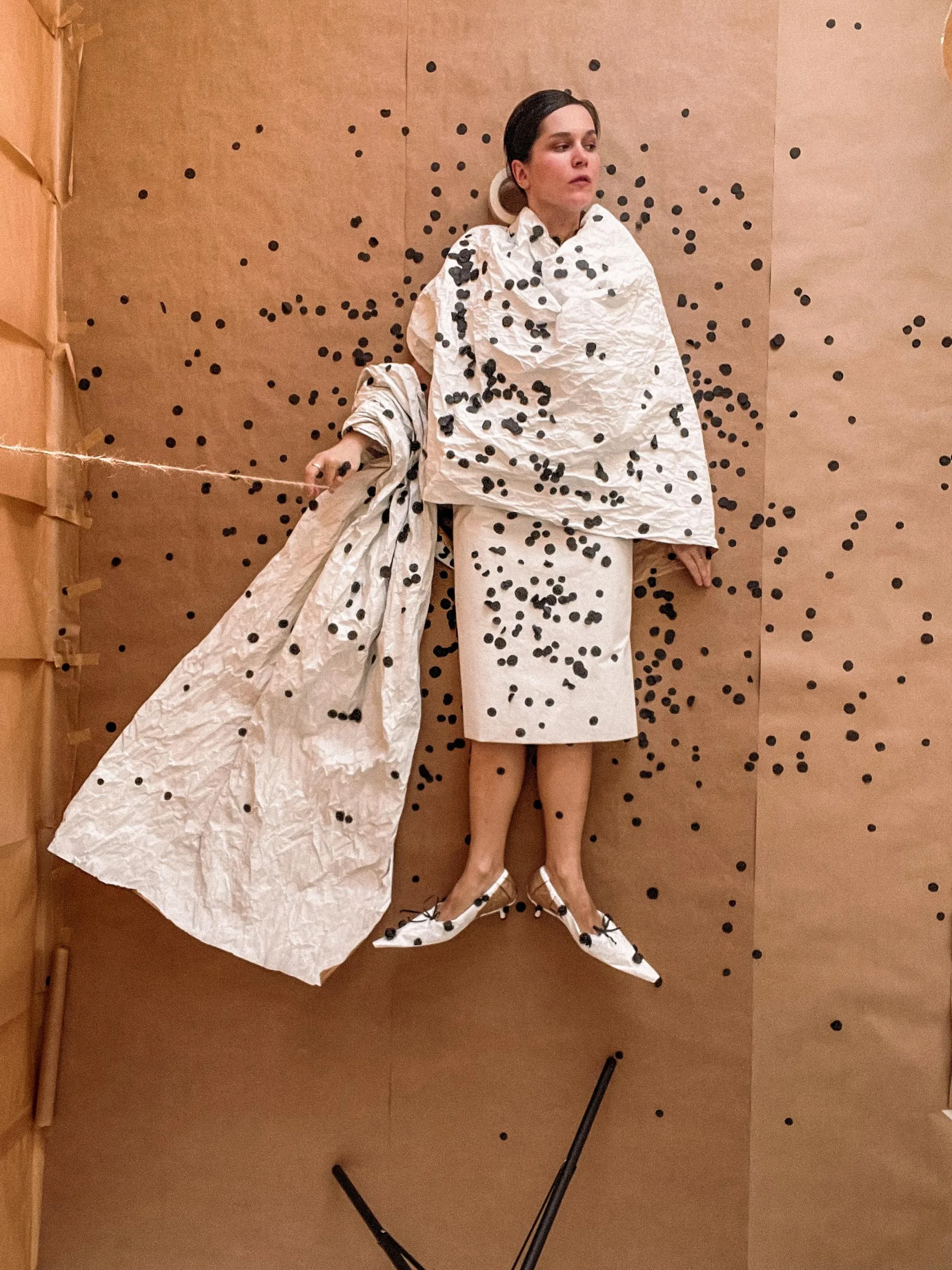 Alla's Nocturnal Visions: Transforming Sheets of Paper into Enchanting Wearable Worlds in St. Petersburg A detailed display of colorful paper accessories fashioned as wearable art.