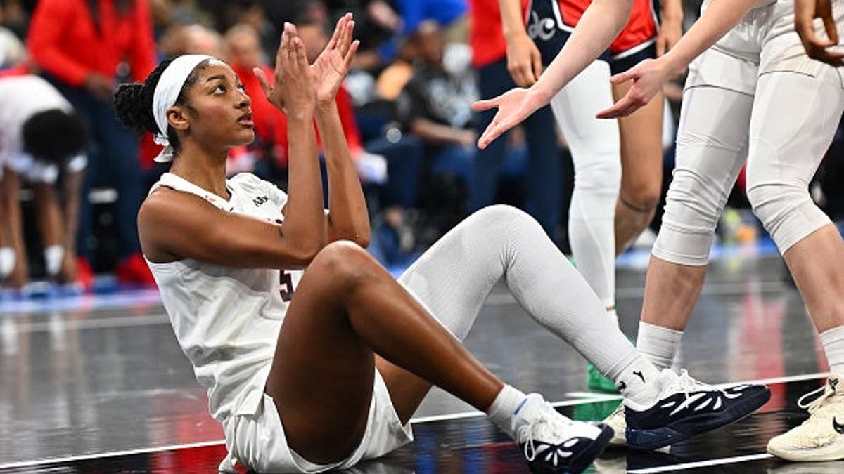 Angel Reese of the Atlanta Dream reacting to a foul during a basketball game