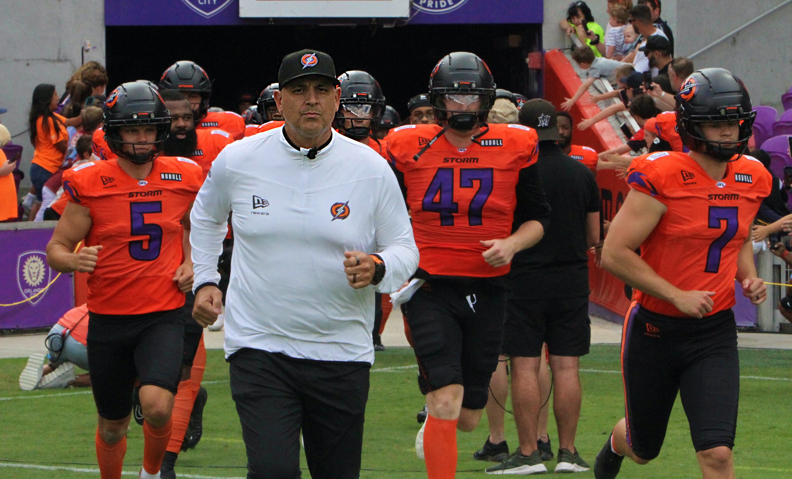 Orlando coach Anthony Becht leads the team onto the field...