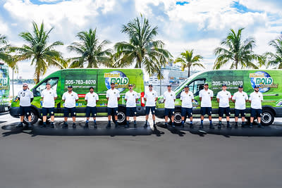 Miami Mold Specialist team members stand alongside the company's South Florida service fleet, reflecting the organization's continued growth and commitment to advanced mold remediation, indoor air quality restoration, and preventative environmental solutions across Miami-Dade, Broward, Palm Beach, and Monroe counties.