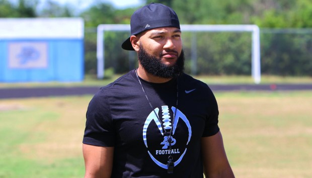 Former Dr. Phillips player Caleb Walls, 27, takes over as the new head football coach at DP, his first head coaching position. (Chris Hays/Orlando Sentinel)