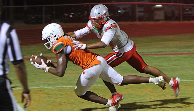 Jones sophomore receiver Cameron Tooley catches a second-half touchdown pass against Lake Mary in a spring game Wednesday night. (Chris Hays/Orlando Sentinel)