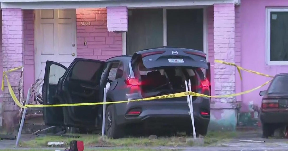 Car crashes inches from Miami-Dade home leaving at least 1 injured, officials say
