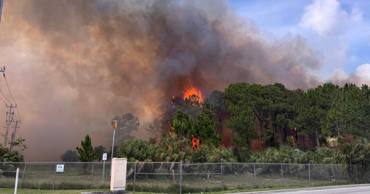 Large grass fire burning in southwest Miami-Dade brought under control by MDFR crews