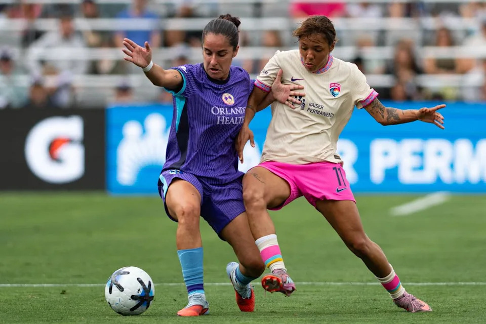 San Diego Wave midfielder Gia Corley (11) fights for possession during an NWSL match between Orlando Pride SC and San Diego Wave FC on Sunday, May 24, 2026 at Snapdragon Stadium in San Diego Calif.