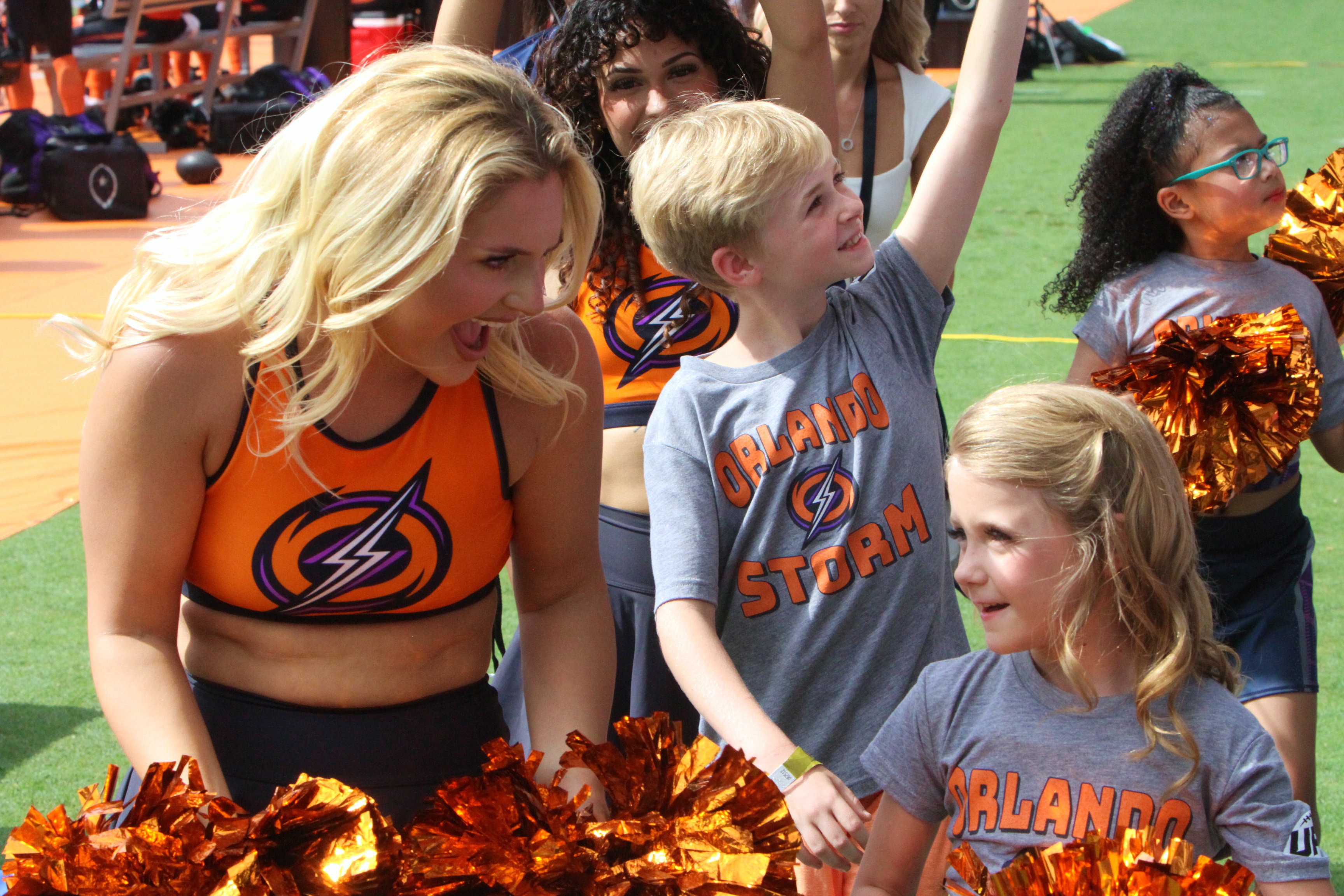 A member of the Orlando Surge dance helps the youngsters...