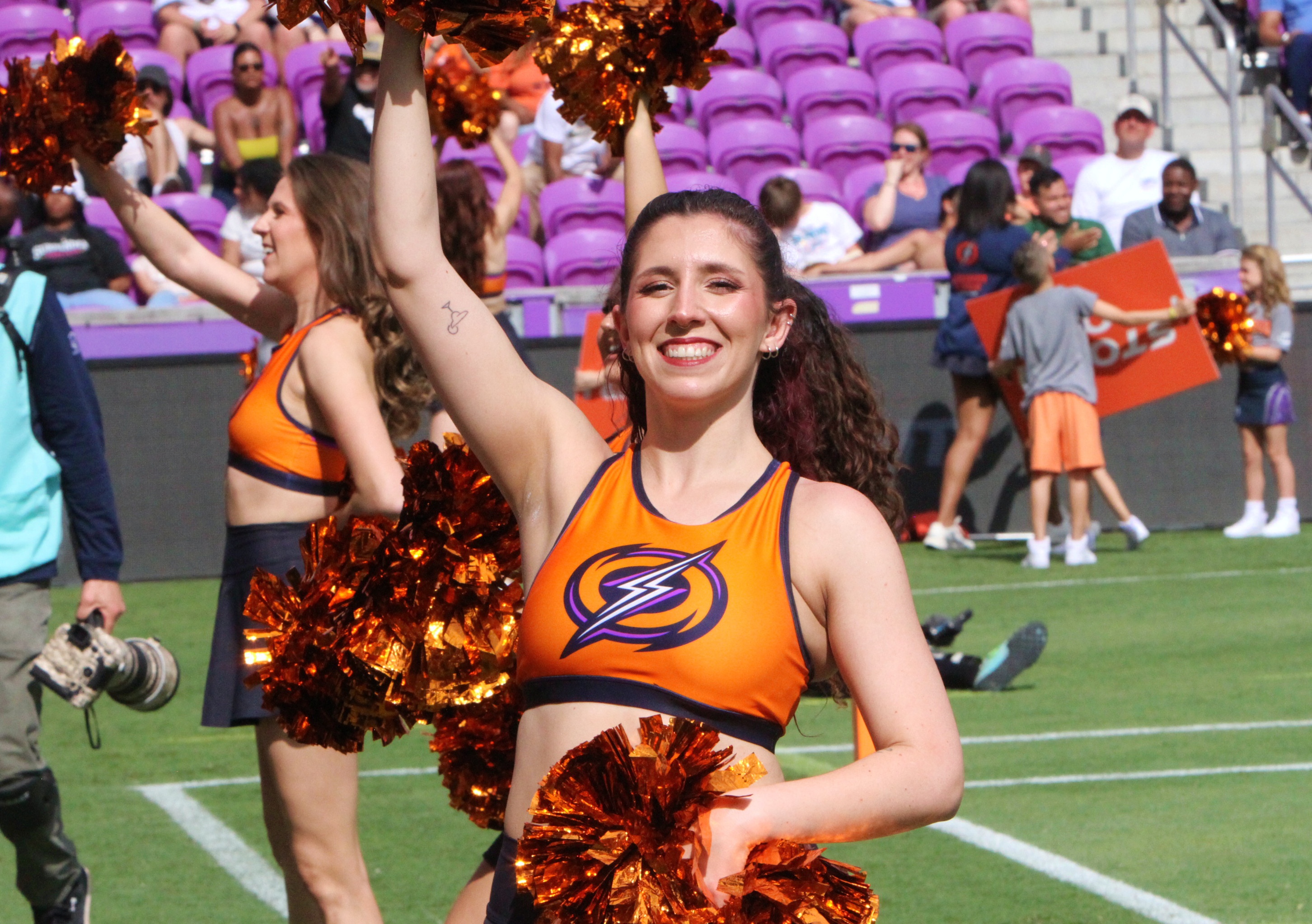 A member of the Orlando Storm Surge dance team shows...
