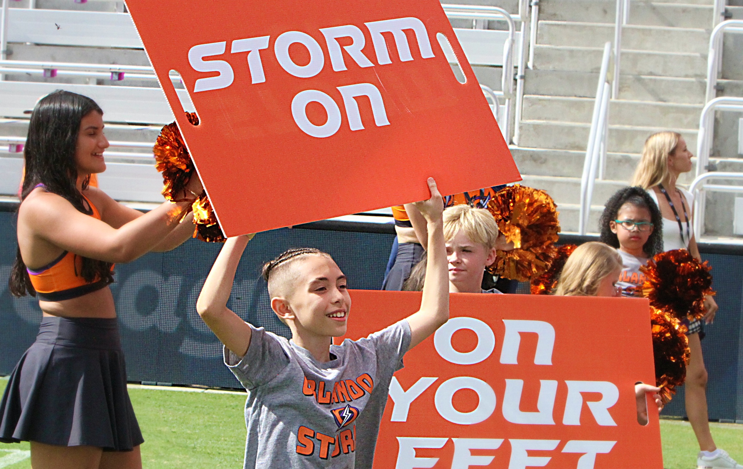 A young Orlando Storm Surge yell leader shows his support...
