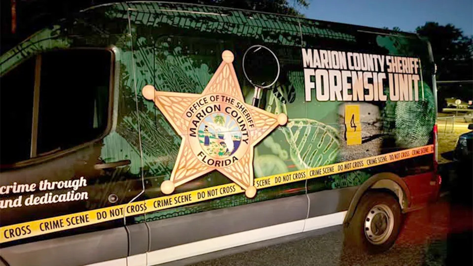 A Marion County Sheriff Forensic Unit van parked at a scene in Florida
