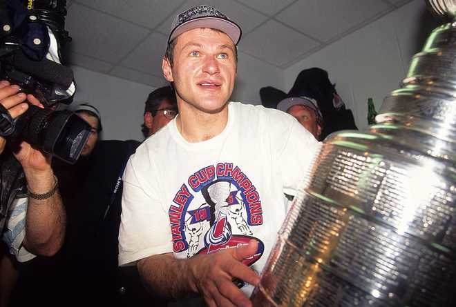 1996 Stanley Cup: Colorado Avalanche v Florida Panthers MIAMI - JUNE 10: Claude Lemieux of the Colorado Avalanche celebrates with the Stanley Cup after winning game 4 against the Florida Panthers during the 1996 Stanley Cup playoffs on June 10, 1996 at Miami Arena in Miami, Florida. (Photo by: B Bennett/Getty Images)