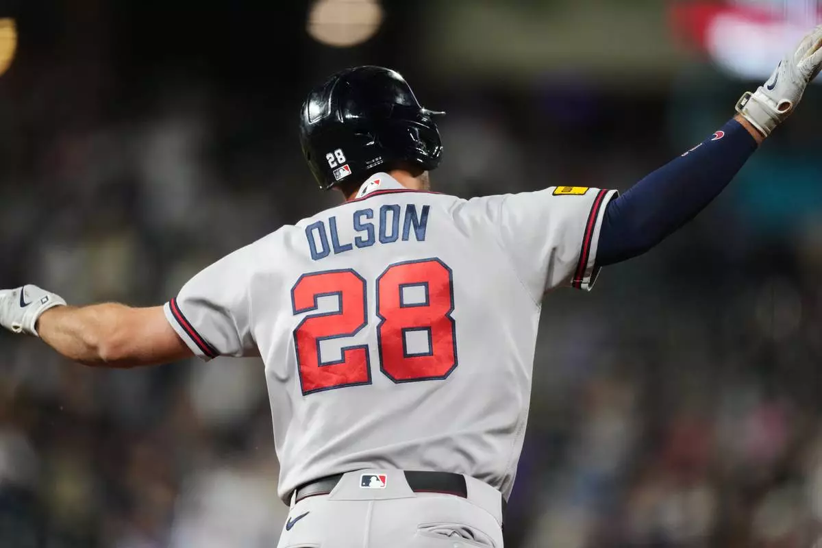 Atlanta Braves' Matt Olson gestures to the bullpen as he circles the bases after hitting a solo home run off Colorado Rockies relief pitcher Tanner Gordon in the ninth inning of a baseball game Saturday, May 2, 2026, in Denver. (AP Photo/David Zalubowski)