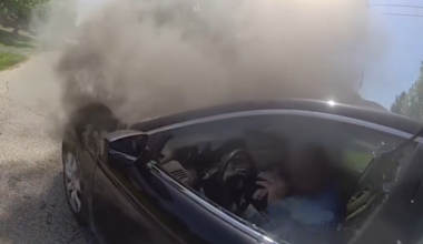 Miami Township police officers help man escape from burning car