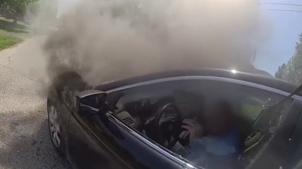 Miami Township police officers help man escape from burning car