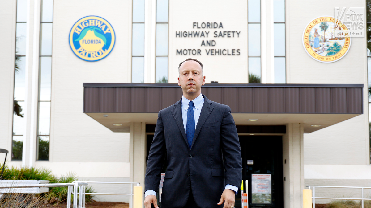 Dave Kerner stands in front of the Florida Highway Safety and Motor Vehicles building in Florida.