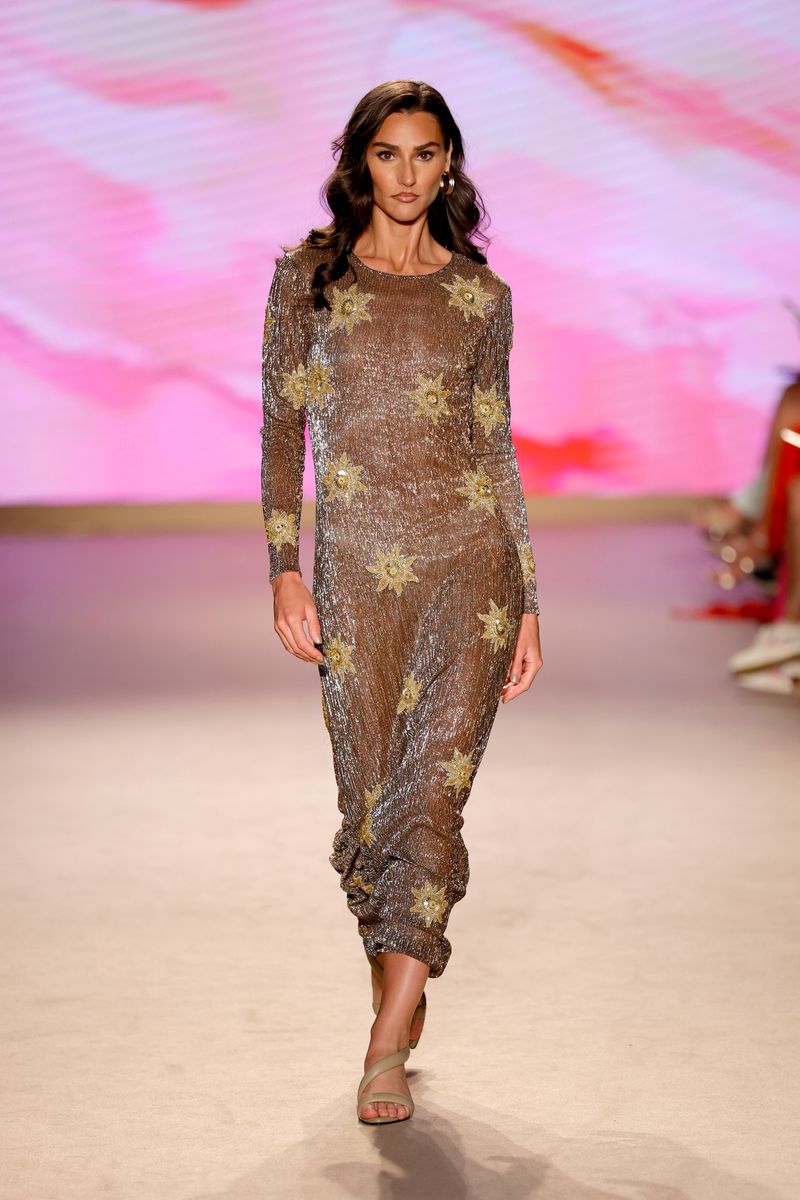 A flowing sheer overlay added movement and dimension to this runway look.