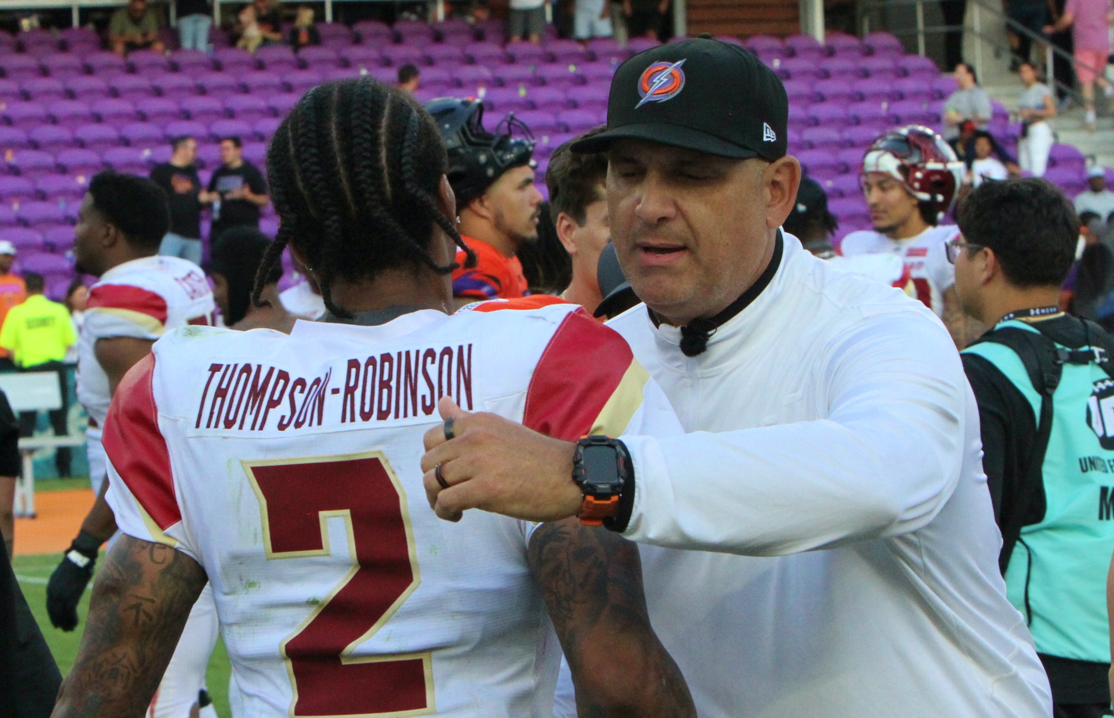 Orlando Storm coach Anthony Becht greets former Storm quarterback Dorian...