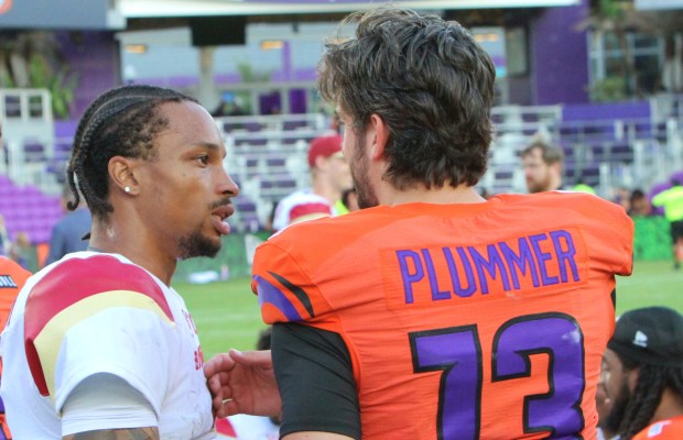 Dorian Thompson-Robinson greets his former Orlando Storm teammate Jack Plummer after DTR led the Birmingham Stallions to a 20-17 victory over the Storm on Sunday. (Chris Hays/Orlando Sentinel)
