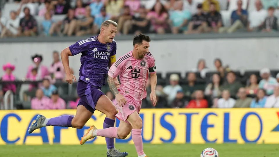 Lionel Messi runs with the ball whilst under pressure from <a class="link " href="https://sports.yahoo.com/soccer/players/1753670/" data-i13n="sec:content-canvas;subsec:anchor_text;elm:context_link" data-ylk="slk:Robin Jansson;sec:content-canvas;subsec:anchor_text;elm:context_link;itc:0" data-yga="{"yLinkElement":"context_link","yModuleName":"content-canvas","yLinkText":"Robin Jansson","ySubModuleName":"anchor_text","yHasCommerce":false}">Robin Jansson</a> during the MLS match between Inter Miami CF and <a class="link " href="https://sports.yahoo.com/soccer/teams/orlando/" data-i13n="sec:content-canvas;subsec:anchor_text;elm:context_link" data-ylk="slk:Orlando City;sec:content-canvas;subsec:anchor_text;elm:context_link;itc:0" data-yga="{"yLinkElement":"context_link","yModuleName":"content-canvas","yLinkText":"Orlando City","ySubModuleName":"anchor_text","yHasCommerce":false}">Orlando City</a> SC.Photo by Calvin Hernandez&sol;Getty Images