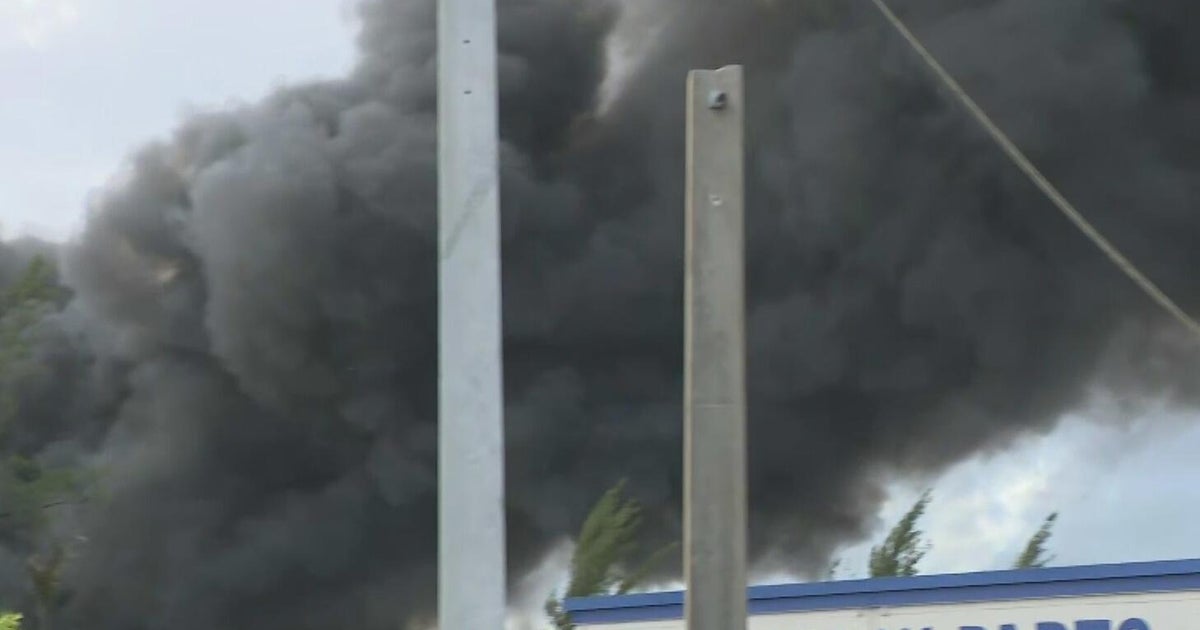 Massive five-alarm junkyard fire sends thick smoke over Opa-locka; no injuries reported