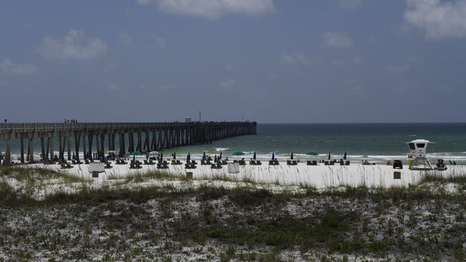 A pier stands at a beach in Panama City, Florida, U.S., on Friday, July 31, 2020.