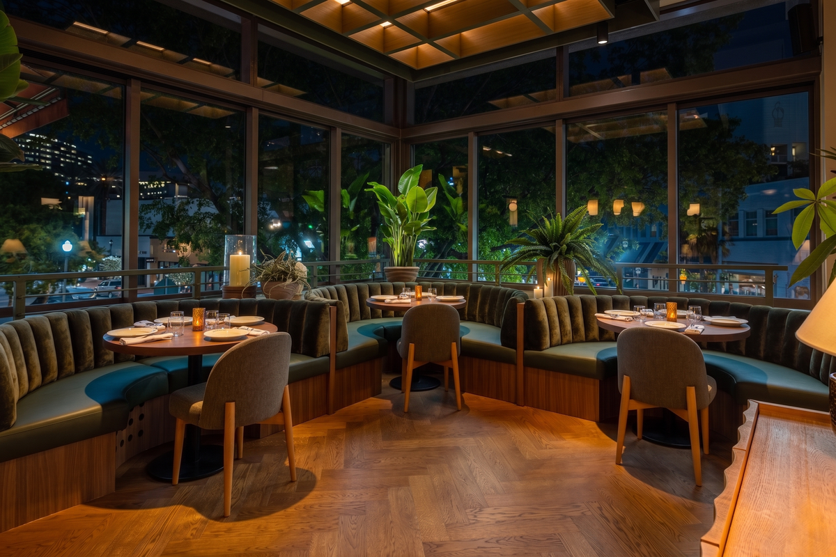 A cozy nook of banquettes at Grand Public Kitchen + Bar in Coconut Grove.