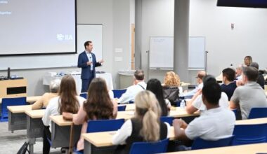 Professor teaching in lecture hall.