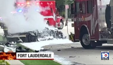 2 people injured after vehicle hits tree, catches fire