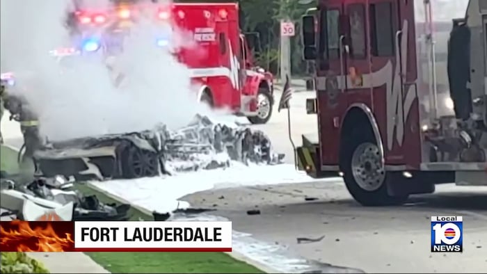 2 people injured after vehicle hits tree, catches fire