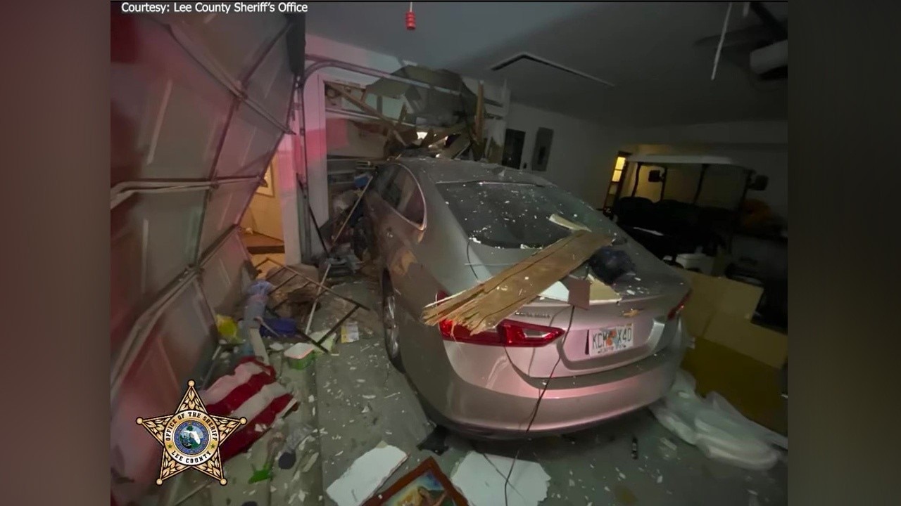 Florida woman drives into house