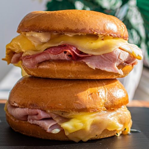 Two breakfast sandwiches stacked on top of each other