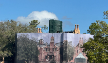 Haunted Mansion behind themed scrim at Magic Kingdom in Walt Disney World