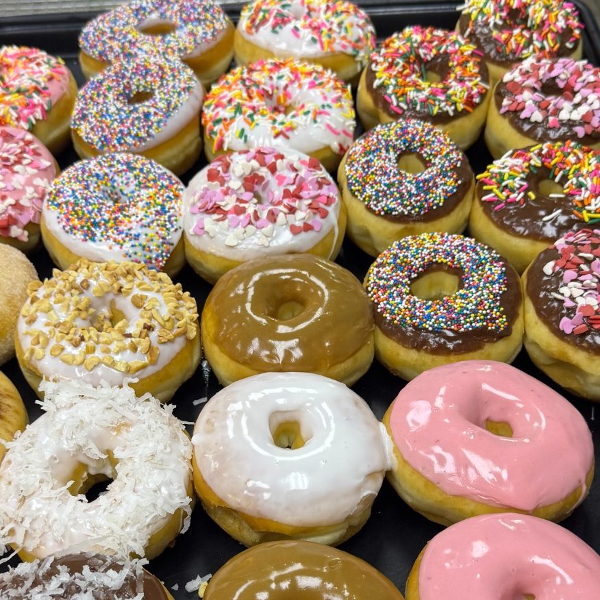 An assortment of glazed and decorated donuts